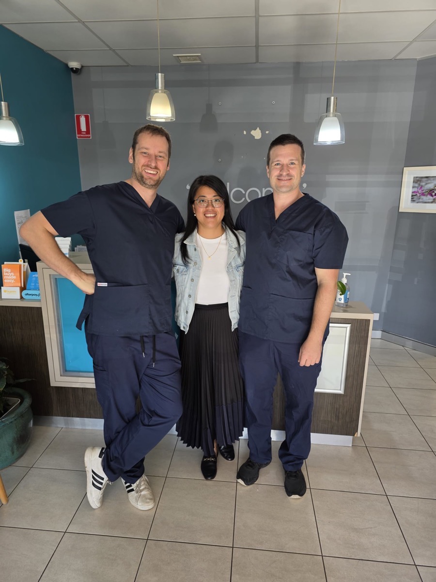 The Sunny Dental Buderim team — Dr Louis George (left), Dwi George (centre), and Dr Jeremy Collins (right) in front of the newly renovated reception